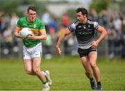 5 June 2022; Keith Beirne of Leitrim in action against Darragh Cummins of Sligo during the Tailteann Cup Quarter-Final match between Leitrim and Sligo at Avant Money Páirc Seán Mac Diarmada, Carrick-on-Shannon in Leitrim. Photo by Ray Ryan/Sportsfile