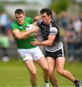 5 June 2022; Keith Beirne of Leitrim in action against Darragh Cummins of Sligo during the Tailteann Cup Quarter-Final match between Leitrim and Sligo at Avant Money Páirc Seán Mac Diarmada, Carrick-on-Shannon in Leitrim. Photo by Ray Ryan/Sportsfile