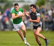 5 June 2022; Keith Beirne of Leitrim in action against Darragh Cummins of Sligo during the Tailteann Cup Quarter-Final match between Leitrim and Sligo at Avant Money Páirc Seán Mac Diarmada, Carrick-on-Shannon in Leitrim. Photo by Ray Ryan/Sportsfile