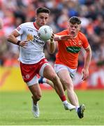 5 June 2022; Michael McKernan of Tyrone and Aidan Nugent of Armagh during the GAA Football All-Ireland Senior Championship Round 1 match between Armagh and Tyrone at Athletic Grounds in Armagh. Photo by Ben McShane/Sportsfile