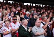 5 June 2022; Supporters stand for a minutes appluase, in the 27th minute, in memory of Michaela McAreavey during the GAA Football All-Ireland Senior Championship Round 1 match between Armagh and Tyrone at Athletic Grounds in Armagh. Photo by Ben McShane/Sportsfile