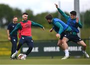6 June 2022; Scott Hogan in action against Ryan Manning and Darragh Lenihan, right, during a Republic of Ireland training session at the FAI National Training Centre in Abbotstown, Dublin. Photo by Stephen McCarthy/Sportsfile