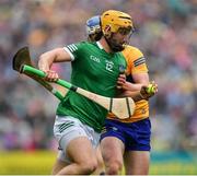 5 June 2022; Tom Morrisey of Limerick is tackled by Diarmuid Ryan of Clare during the Munster GAA Hurling Senior Championship Final match between Limerick and Clare at Semple Stadium in Thurles, Tipperary. Photo by Ray McManus/Sportsfile