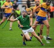 5 June 2022; David Reidy of Limerick is tackled by Robyn Mounsey of Clare during the Munster GAA Hurling Senior Championship Final match between Limerick and Clare at Semple Stadium in Thurles, Tipperary. Photo by Ray McManus/Sportsfile