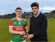6 June 2022; Ray O'Malley of Electric Ireland presents Niall Hurley of Mayo with the Electric Ireland Best & Fairest Award after the Electric Ireland Connacht GAA Minor Football Championship Final match between Galway and Mayo at Hastings Insurance MacHale Park in Castlebar, Mayo. Photo by Piaras Ó Mídheach/Sportsfile