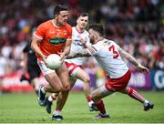 5 June 2022; Stefan Campbell of Armagh in action against Ronan McEntee of Tyrone during the GAA Football All-Ireland Senior Championship Round 1 match between Armagh and Tyrone at Athletic Grounds in Armagh. Photo by Ramsey Cardy/Sportsfile