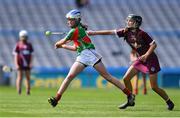7 June 2022; Rachael Ní Laocha of Scoil Mologa, Dublin, in action against Robyn McDonnell of Holy Family Swords, Dublin, during the Corn Olly Quinlan final at the Allianz Cumann na mBunscol Finals in Croke Park, Dublin. Photo by Ben McShane/Sportsfile