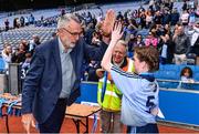 7 June 2022; Uachtarán Chumann Lúthchleas Gael Larry McCarthy with Jess Morris of Scoile Mhuire Lucan, Dublin after the Corn INTO final at the Allianz Cumann na mBunscol Finals in Croke Park, Dublin. Over 2,800 schools and 200,000 students are set to compete in the primary schools competition this year with finals taking place across the country. Allianz and Cumann na mBunscol are also gifting 500 footballs, 200 hurleys and 200 sliotars to schools across the country to welcome Ukrainian students into our national games and local communities. Photo by Ben McShane/Sportsfile
