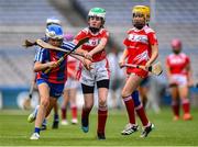 7 June 2022; Síomha Ní Eara of GS Chonc Liomhna, Dublin, in action against Clodagh Grimes of St Benidict's NS Ongar, Dublin, during the Corn Uí Siochan final at the Allianz Cumann na mBunscol Finals in Croke Park, Dublin. Over 2,800 schools and 200,000 students are set to compete in the primary schools competition this year with finals taking place across the country. Allianz and Cumann na mBunscol are also gifting 500 footballs, 200 hurleys and 200 sliotars to schools across the country to welcome Ukrainian students into our national games and local communities. Photo by Ben McShane/Sportsfile