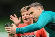 7 June 2022; Republic of Ireland's Seamus Coleman video calls his Everton club-mate Vitaliy Mykolenko, to speak to 12-year-old Ukrainian citizen Mattvii Rybkin, from Zhytomyr, who was invited to watch a Republic of Ireland training session at Aviva Stadium in Dublin. Photo by Stephen McCarthy/Sportsfile