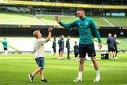 7 June 2022; Shane Duffy high-fives Ukrainian citizen Illia Sydorenko, age 8, from Zhytomyr, during a Republic of Ireland training session at Aviva Stadium in Dublin. Photo by Stephen McCarthy/Sportsfile