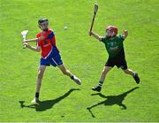 8 June 2022; Diarmuid O'Brien of Belgrove BNS in action against Alex McMahon of Scoil Mhuire, Lucan, during the Corn Herald final at the Allianz Cumann na mBunscoil Hurling Finals in Croke Park, Dublin. Over 2,800 schools and 200,000 students are set to compete in the primary schools competition this year with finals taking place across the country. Allianz and Cumann na mBunscol are also gifting 500 footballs, 200 hurleys and 200 sliotars to schools across the country to welcome Ukrainian students into our national games and local communities. Photo by Piaras Ó Mídheach/Sportsfile