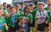 8 June 2022; Victor Adanikin, team captain of Scoil Mhuire, Lucan, celebrates with his teammates after their victory over Belgrove BNS in the Corn Herald final at the Allianz Cumann na mBunscoil Hurling Finals in Croke Park, Dublin. Over 2,800 schools and 200,000 students are set to compete in the primary schools competition this year with finals taking place across the country. Allianz and Cumann na mBunscol are also gifting 500 footballs, 200 hurleys and 200 sliotars to schools across the country to welcome Ukrainian students into our national games and local communities. Photo by Piaras Ó Mídheach/Sportsfile