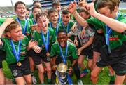 8 June 2022; Victor Adanikin, team captain of Scoil Mhuire, Lucan, celebrates with his teammates after their victory over Belgrove BNS in the Corn Herald final at the Allianz Cumann na mBunscoil Hurling Finals in Croke Park, Dublin. Over 2,800 schools and 200,000 students are set to compete in the primary schools competition this year with finals taking place across the country. Allianz and Cumann na mBunscol are also gifting 500 footballs, 200 hurleys and 200 sliotars to schools across the country to welcome Ukrainian students into our national games and local communities. Photo by Piaras Ó Mídheach/Sportsfile