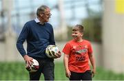 7 June 2022; FAI chairman Roy Barrett and Ukrainian citizen Mattvii Rybkin, age 12, from Zhytomyr, during a Republic of Ireland training session at Aviva Stadium in Dublin. Photo by Stephen McCarthy/Sportsfile