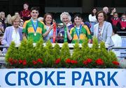 8 June 2022; Members of the Ryder family, from left, Noreen Licken, Katherine Licken, Kathleen O'Malley and Anne Gilmore present the Tom Ryder cup to the captains of Scoil Oilibheir, Coolmine, Senan Ó Broin, left, and Riain De Búrca after their side's victory over Holy Trinity SNS in the Corn Tom Ryder final at the Allianz Cumann na mBunscoil Hurling Finals in Croke Park, Dublin. Over 2,800 schools and 200,000 students are set to compete in the primary schools competition this year with finals taking place across the country. Allianz and Cumann na mBunscol are also gifting 500 footballs, 200 hurleys and 200 sliotars to schools across the country to welcome Ukrainian students into our national games and local communities. Photo by Piaras Ó Mídheach/Sportsfile