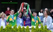 8 June 2022; Members of the Ryder family, from left, Noreen Licken, Katherine Licken, Kathleen O'Malley and Anne Gilmore present the Tom Ryder cup to the captains of Scoil Oilibheir, Coolmine, Senan Ó Broin, left, and Riain De Búrca after their side's victory over Holy Trinity SNS in the Corn Tom Ryder final at the Allianz Cumann na mBunscoil Hurling Finals in Croke Park, Dublin. Over 2,800 schools and 200,000 students are set to compete in the primary schools competition this year with finals taking place across the country. Allianz and Cumann na mBunscol are also gifting 500 footballs, 200 hurleys and 200 sliotars to schools across the country to welcome Ukrainian students into our national games and local communities. Photo by Piaras Ó Mídheach/Sportsfile