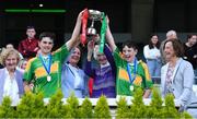 8 June 2022; Members of the Ryder family, from left, Noreen Licken, Katherine Licken, Kathleen O'Malley and Anne Gilmore present the Tom Ryder cup to the captains of Scoil Oilibheir, Coolmine, Senan Ó Broin, left, and Riain De Búrca after their side's victory over Holy Trinity SNS in the Corn Tom Ryder final at the Allianz Cumann na mBunscoil Hurling Finals in Croke Park, Dublin. Over 2,800 schools and 200,000 students are set to compete in the primary schools competition this year with finals taking place across the country. Allianz and Cumann na mBunscol are also gifting 500 footballs, 200 hurleys and 200 sliotars to schools across the country to welcome Ukrainian students into our national games and local communities. Photo by Piaras Ó Mídheach/Sportsfile