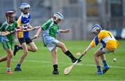 8 June 2022; Kevin Scinéir of Scoil Naithí scores a goal past Scoil Treasa, Firhouse, goalkeeper TJ Vaughan during the Corn Sean O Rinn final at the Allianz Cumann na mBunscoil Hurling Finals in Croke Park, Dublin. Over 2,800 schools and 200,000 students are set to compete in the primary schools competition this year with finals taking place across the country. Allianz and Cumann na mBunscol are also gifting 500 footballs, 200 hurleys and 200 sliotars to schools across the country to welcome Ukrainian students into our national games and local communities. Photo by Piaras Ó Mídheach/Sportsfile