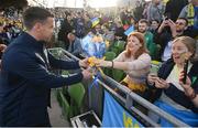 8 June 2022; Republic of Ireland captain Seamus Coleman presents flowers to a Ukraine supporter before the UEFA Nations League B group 1 match between Republic of Ireland and Ukraine at Aviva Stadium in Dublin. Photo by Stephen McCarthy/Sportsfile