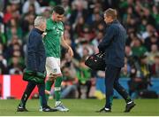 8 June 2022; John Egan of Republic of Ireland leaves the field with Republic of Ireland Team doctor Alan Byrne and chartered physiotherapist Danny Miller during the UEFA Nations League B group 1 match between Republic of Ireland and Ukraine at Aviva Stadium in Dublin. Photo by Stephen McCarthy/Sportsfile