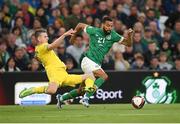 8 June 2022; CJ Hamilton of Republic of Ireland is tackled by Oleksandr Syrota of Ukraine during the UEFA Nations League B group 1 match between Republic of Ireland and Ukraine at Aviva Stadium in Dublin. Photo by Stephen McCarthy/Sportsfile