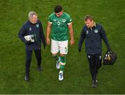 8 June 2022; John Egan of Republic of Ireland leaves the pitch to receive medical attention for an injury, with team doctor Alan Byrne, left, and chartered physiotherapist Danny Miller during the UEFA Nations League B group 1 match between Republic of Ireland and Ukraine at Aviva Stadium in Dublin. Photo by Eóin Noonan/Sportsfile
