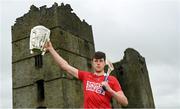 9 June 2022; Robert Downey of Cork poses for a portrait with the Liam MacCarthy Cup at Loughmore Castle at the GAA Hurling All-Ireland Senior Championship Series national launch in Tipperary. Photo by Brendan Moran/Sportsfile