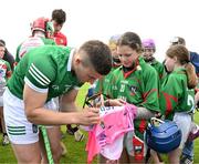 9 June 2022; In attendance at the GAA Hurling All-Ireland Senior Championship Series national launch at Loughmore-Castleiney GAA Club in Tipperary is Mike Casey of Limerick who signed a Tipperary jersey for eleven year old Ella Maher. Photo by Ray McManus/Sportsfile