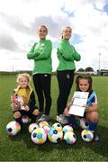 12 June 2022; Republic of Ireland internationals Jess Ziu, left, and Emily Whelan with Anna Butkevice, age 8, left, and Nico Hurkoo, age 8, of Kinsealy United U9's at the launch of UEFA Disney Playmakers 2022 at the FAI National Training Centre in Abbotstown, Dublin. Photo by Stephen McCarthy/Sportsfile