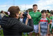 9 June 2022; In attendance at the GAA Hurling All-Ireland Senior Championship Series national launch at Loughmore-Castleiney GAA Club in Tipperary are is Mike Casey of Limerick posing for a photo with young Loughmore-Castleiney GAA player Cathal Breen. Photo by Brendan Moran/Sportsfile