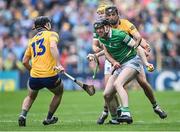 5 June 2022; Declan Hannon of Limerick in action against Clare players Cathal Malone and Ian Galvin, 13, during the Munster GAA Hurling Senior Championship Final match between Limerick and Clare at FBD Semple Stadium in Thurles, Tipperary. Photo by Piaras Ó Mídheach/Sportsfile