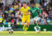 8 June 2022; Serhiy Sydorchuk of Ukraine and Chiedozie Ogbene of Republic of Ireland during the UEFA Nations League B group 1 match between Republic of Ireland and Ukraine at Aviva Stadium in Dublin. Photo by Ben McShane/Sportsfile