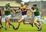11 June 2022; Oisín Foley of Wexford in action against Eoin Ross and Colum Harty of Kerry during the GAA Hurling All-Ireland Senior Championship Preliminary Quarter-Final match between Kerry and Wexford at Austin Stack Park in Tralee, Kerry. Photo by Diarmuid Greene/Sportsfile