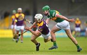 11 June 2022; Oisín Foley of Wexford in action against Eric Leen of Kerry during the GAA Hurling All-Ireland Senior Championship Preliminary Quarter-Final match between Kerry and Wexford at Austin Stack Park in Tralee, Kerry. Photo by Diarmuid Greene/Sportsfile