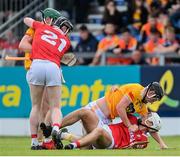 11 June 2022; Players tussle during the GAA Hurling All-Ireland Senior Championship Preliminary Quarter-Final match between Antrim and Cork at Corrigan Park in Belfast. Photo by Ramsey Cardy/Sportsfile