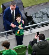 11 June 2022; Republic of Ireland manager Stephen Kenny poses for a photograph with a young supporter before the UEFA Nations League B group 1 match between Republic of Ireland and Scotland at the Aviva Stadium in Dublin. Photo by Ben McShane/Sportsfile