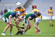 8 June 2022; St Pius X BNS players Conor O'Brien, right, and David Lombard in action against Joseph Davy of St Laurence's, Kilmacud, left, during the Corn Marino final at the Allianz Cumann na mBunscoil Hurling Finals in Croke Park, Dublin. Over 2,800 schools and 200,000 students are set to compete in the primary schools competition this year with finals taking place across the country. Allianz and Cumann na mBunscol are also gifting 500 footballs, 200 hurleys and 200 sliotars to schools across the country to welcome Ukrainian students into our national games and local communities. Photo by Piaras Ó Mídheach/Sportsfile
