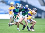 8 June 2022; Oscar Morgan of St Pius X BNS, left, in action against Tiernan Walsh of St Laurence's, Kilmacud, during the Corn Marino final at the Allianz Cumann na mBunscoil Hurling Finals in Croke Park, Dublin. Over 2,800 schools and 200,000 students are set to compete in the primary schools competition this year with finals taking place across the country. Allianz and Cumann na mBunscol are also gifting 500 footballs, 200 hurleys and 200 sliotars to schools across the country to welcome Ukrainian students into our national games and local communities. Photo by Piaras Ó Mídheach/Sportsfile