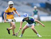 8 June 2022; David Lombard of St Pius X BNS, right, in action against Joseph Davy of St Laurence's, Kilmacud, during the Corn Marino final at the Allianz Cumann na mBunscoil Hurling Finals in Croke Park, Dublin. Over 2,800 schools and 200,000 students are set to compete in the primary schools competition this year with finals taking place across the country. Allianz and Cumann na mBunscol are also gifting 500 footballs, 200 hurleys and 200 sliotars to schools across the country to welcome Ukrainian students into our national games and local communities. Photo by Piaras Ó Mídheach/Sportsfile