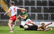 11 June 2022; Odhran Ferris of Kerry in action against Conor McAneney of Tyrone during the Electric Ireland GAA Football All-Ireland Minor Championship Quarter-Final match between Tyrone and Kerry at MW Hire O'Moore Park in Portlaoise, Laois. Photo by David Fitzgerald/Sportsfile