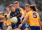 11 June 2022; Diarmuid Murtagh of Roscommon is tackled by Cian O'Dea, 5, Emmet McMahon and Darren O'Neill  of Clare during the GAA Football All-Ireland Senior Championship Round 2 match between Clare and Roscommon at Croke Park in Dublin. Photo by Ray McManus/Sportsfile