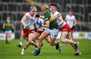 11 June 2022; Odhran Ferris of Kerry in action against Barry McMenamin, left, and Eoin McElholm of Tyrone during the Electric Ireland GAA Football All-Ireland Minor Championship Quarter-Final match between Tyrone and Kerry at MW Hire O'Moore Park in Portlaoise, Laois. Photo by David Fitzgerald/Sportsfile