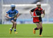 8 June 2022; Lily Walsh of St Olaf's, Sandyford, in action against Amaya Byrne of Garran Mhuire, Goatstown, during the Corn Haughey final at the Allianz Cumann na mBunscoil Hurling Finals in Croke Park, Dublin. Over 2,800 schools and 200,000 students are set to compete in the primary schools competition this year with finals taking place across the country. Allianz and Cumann na mBunscol are also gifting 500 footballs, 200 hurleys and 200 sliotars to schools across the country to welcome Ukrainian students into our national games and local communities. Photo by Piaras Ó Mídheach/Sportsfile