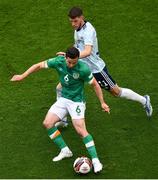 11 June 2022; Josh Cullen of Republic of Ireland and Ryan Christie of Scotland during the UEFA Nations League B group 1 match between Republic of Ireland and Scotland at the Aviva Stadium in Dublin. Photo by Ben McShane/Sportsfile
