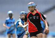 8 June 2022; Caoimhe Phelan of St Olaf's, Sandyford, in action against Sadie O'Rafferty of Garran Mhuire, Goatstown, during the Corn Haughey final at the Allianz Cumann na mBunscoil Hurling Finals in Croke Park, Dublin. Over 2,800 schools and 200,000 students are set to compete in the primary schools competition this year with finals taking place across the country. Allianz and Cumann na mBunscol are also gifting 500 footballs, 200 hurleys and 200 sliotars to schools across the country to welcome Ukrainian students into our national games and local communities. Photo by Piaras Ó Mídheach/Sportsfile