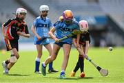 8 June 2022; Lily Walsh of St Olaf's, Sandyford, right, in action against Lucy Clinch of Garran Mhuire, Goatstown, during the Corn Haughey final at the Allianz Cumann na mBunscoil Hurling Finals in Croke Park, Dublin. Over 2,800 schools and 200,000 students are set to compete in the primary schools competition this year with finals taking place across the country. Allianz and Cumann na mBunscol are also gifting 500 footballs, 200 hurleys and 200 sliotars to schools across the country to welcome Ukrainian students into our national games and local communities. Photo by Piaras Ó Mídheach/Sportsfile
