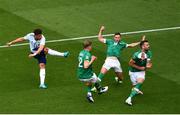 11 June 2022; Ché Adams of Scotland has a shot on goal despite the efforts of Republic of Ireland players, from left, Nathan Collins, Alan Browne and Shane Duffy during the UEFA Nations League B group 1 match between Republic of Ireland and Scotland at the Aviva Stadium in Dublin. Photo by Ben McShane/Sportsfile