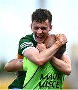 11 June 2022; Paddy Lane of Kerry celebrates with selector Shane O'Rourke after the Electric Ireland GAA Football All-Ireland Minor Championship Quarter-Final match between Tyrone and Kerry at MW Hire O'Moore Park in Portlaoise, Laois. Photo by David Fitzgerald/Sportsfile