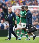11 June 2022; Michael Obafemi of Republic of Ireland leaves the pitch with chartered physiotherapist Kevin Mulholland, right, and team doctor Alan Byrne, after picking up an injury during the UEFA Nations League B group 1 match between Republic of Ireland and Scotland at the Aviva Stadium in Dublin. Photo by Ben McShane/Sportsfile Photo by Stephen McCarthy/Sportsfile